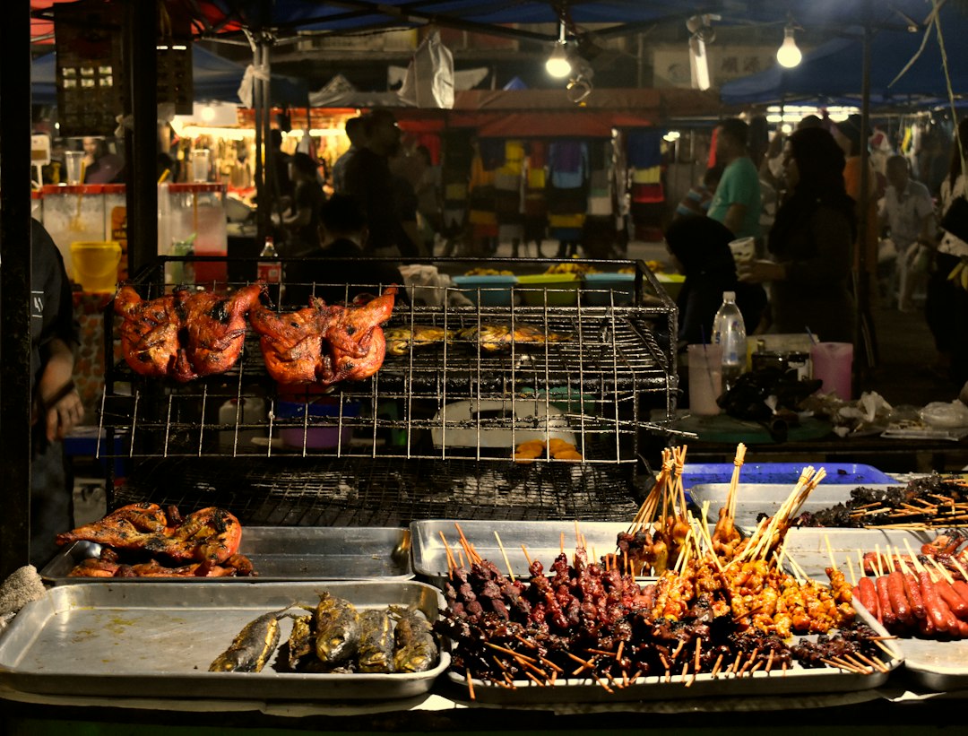 Visitors browsing Sibu night market.